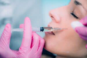 Woman getting injected with dermal filler